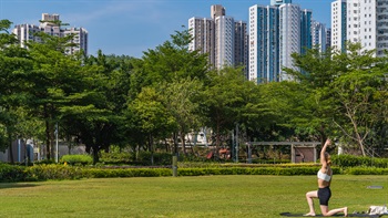 The grassy and lush lawn provides a softer surface for exercises like yoga.